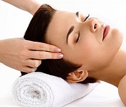 St. Louis Facials model receiving a relaxing head massage.