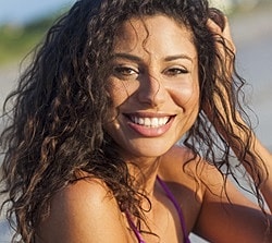 St. Louis Morpheus8 model with curly hair at the beach.