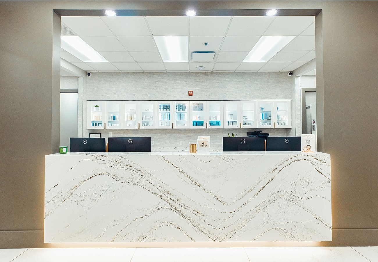 Modern reception desk in a minimalist setting.