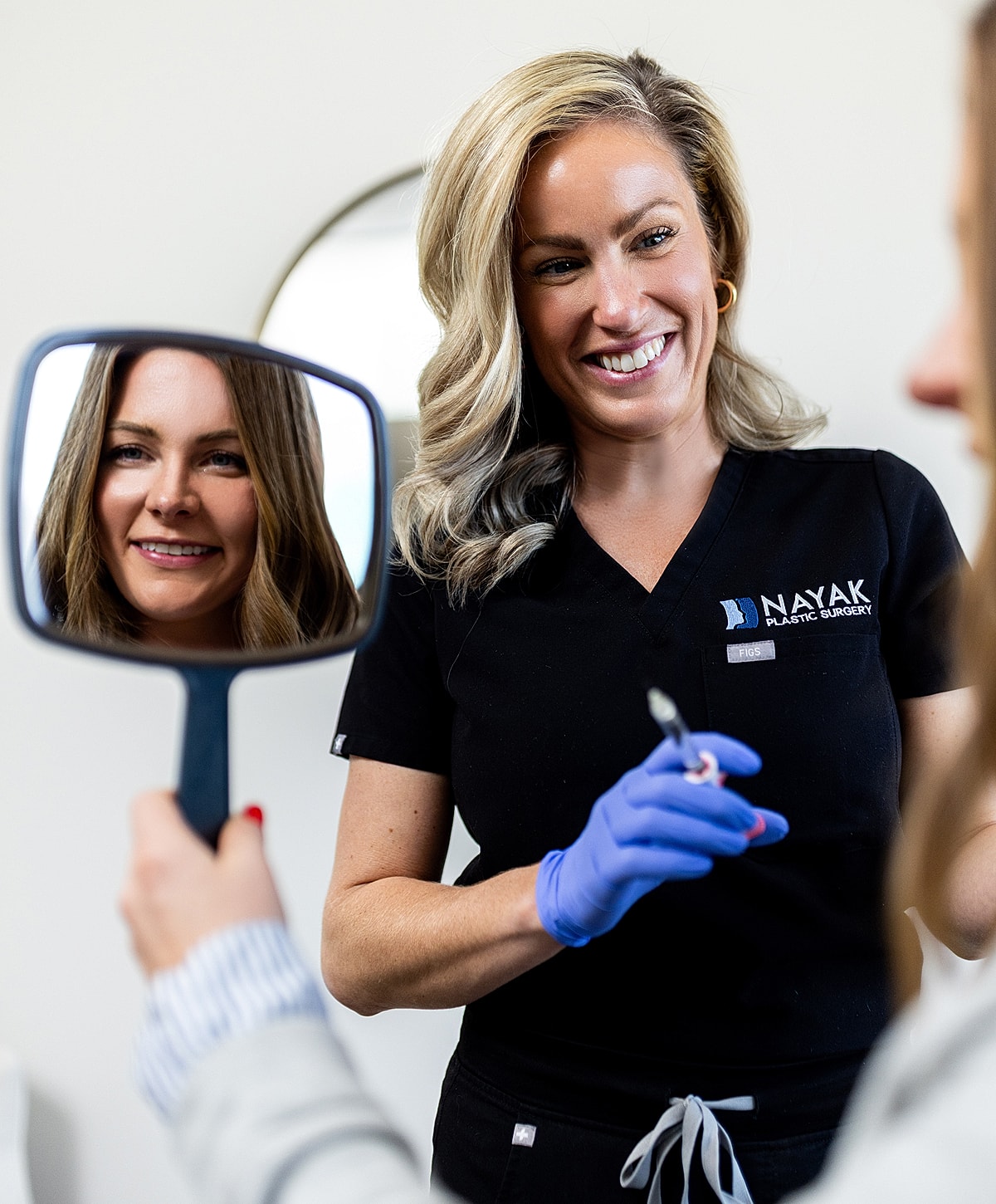 Plastic surgeon consulting with a patient.