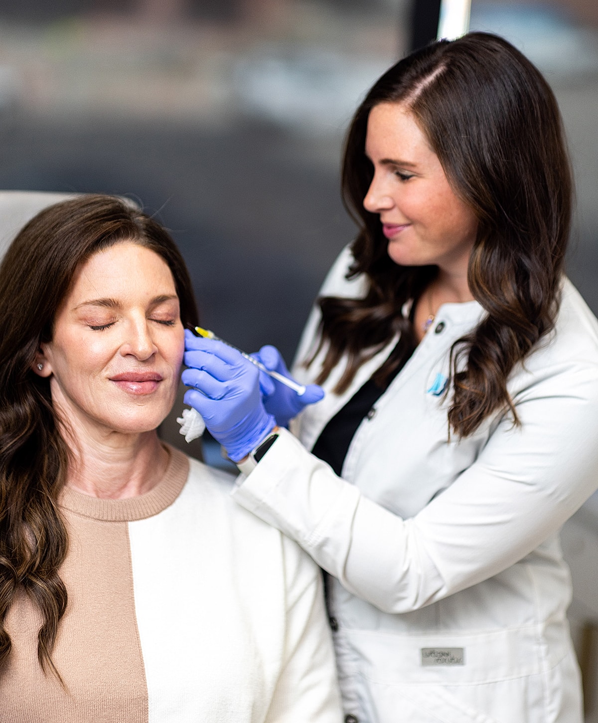 St. Louis Med Spa patient receiving cosmetic treatment from a professional.