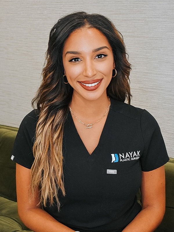 Healthcare professional in a plastic surgery setting.