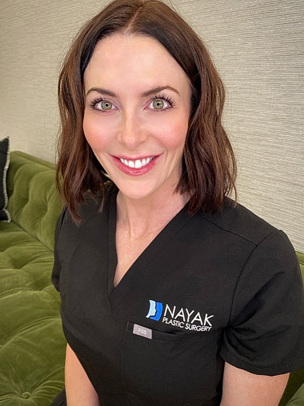 Sarah S smiling in professional attire.