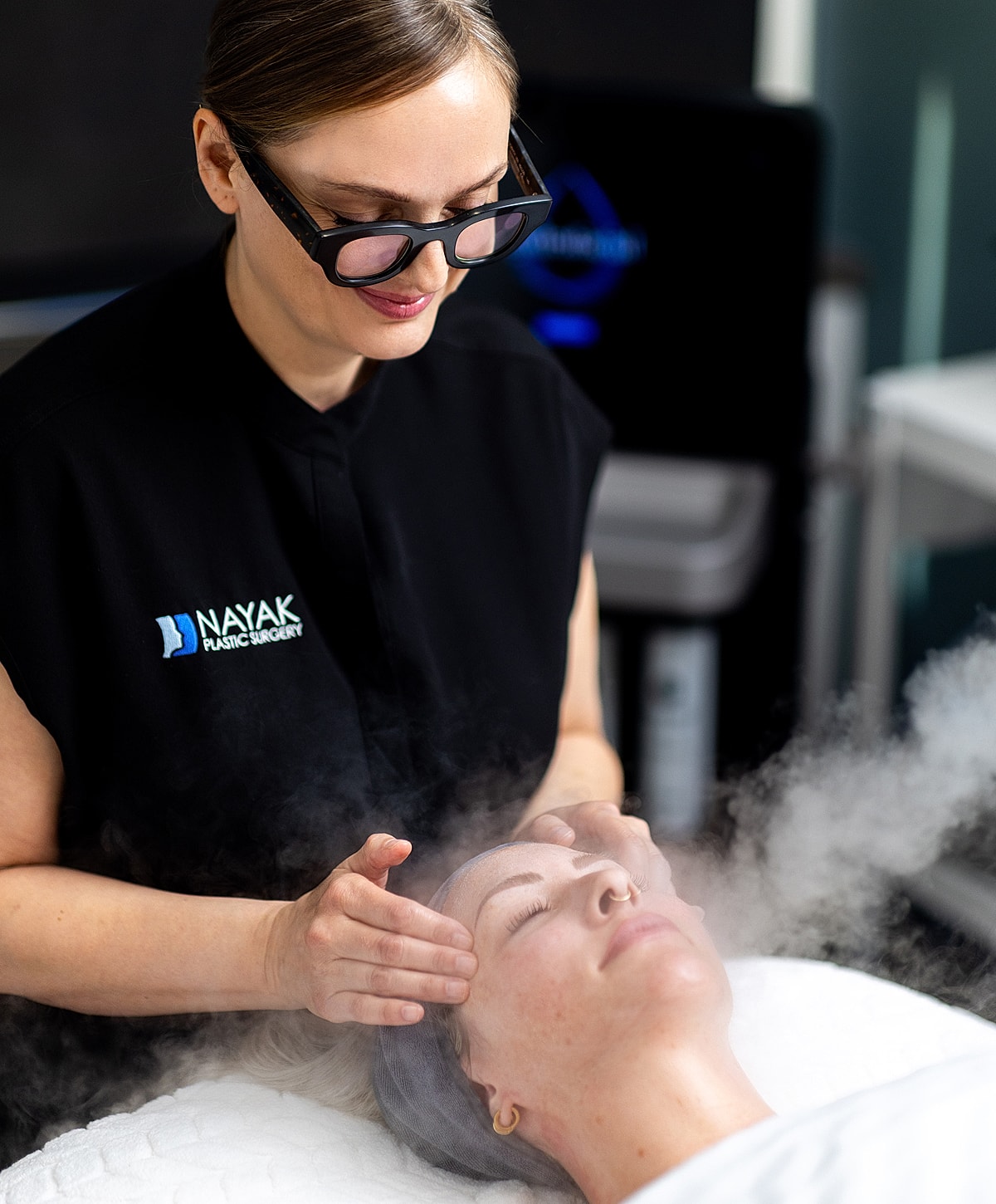 Facial treatment with steaming and massage.