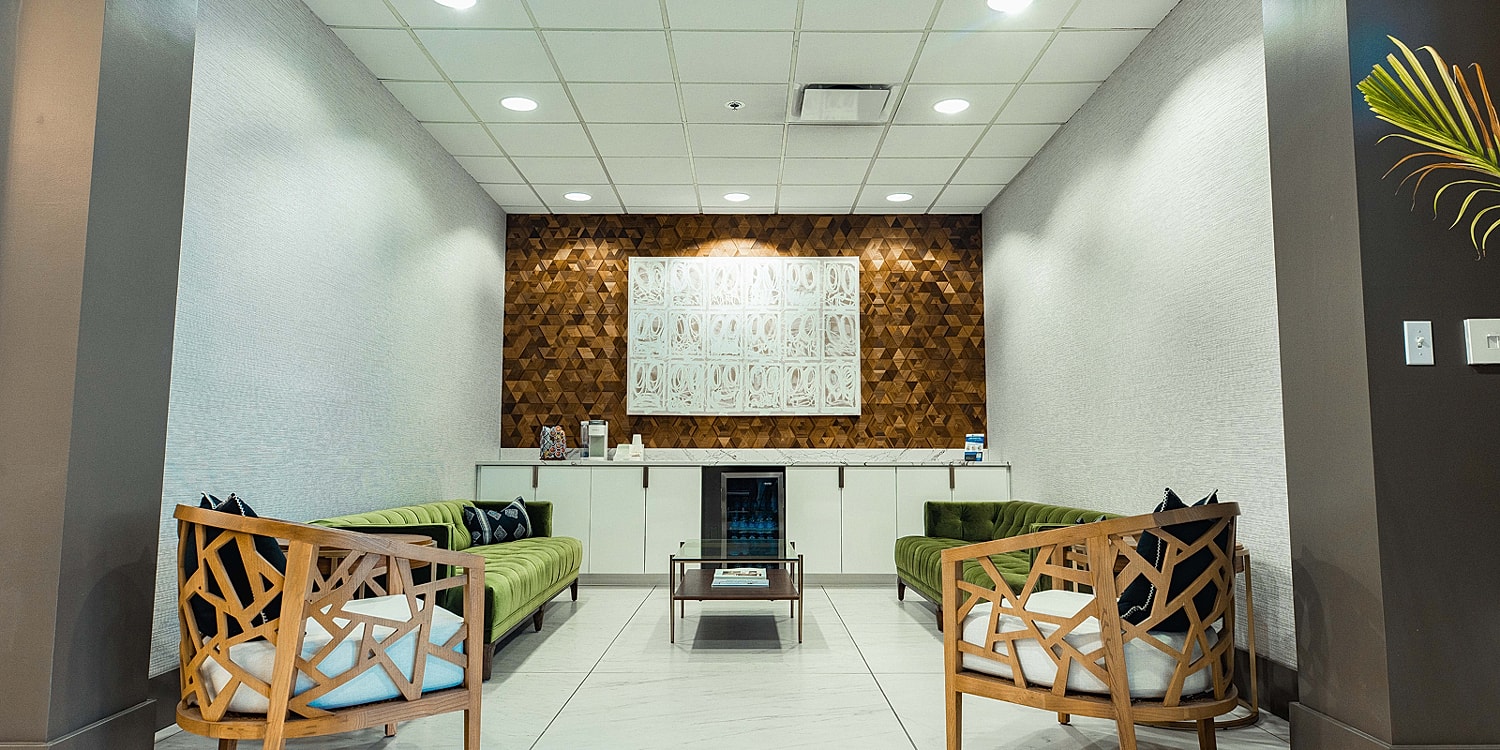 Stylish waiting area with modern seating and decor.