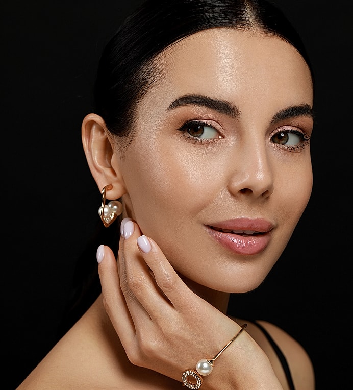 Close-up portrait of a woman in black and white.