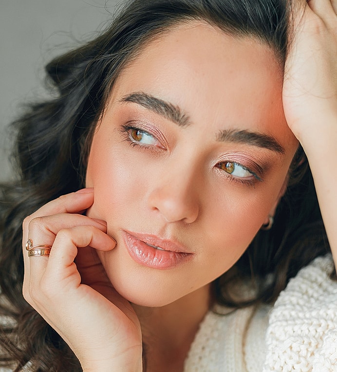 Close-up of a thoughtful young woman.