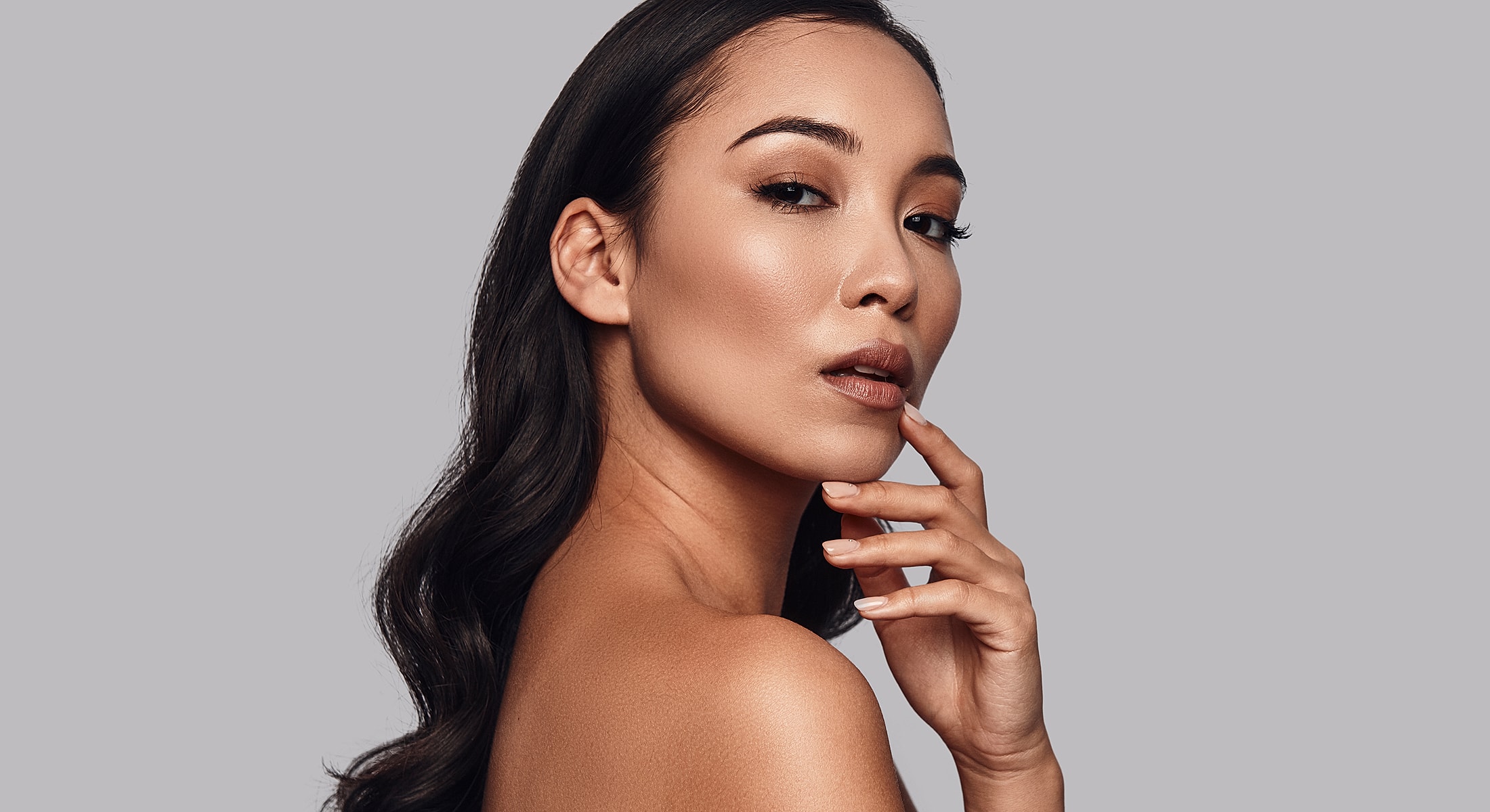 St. Louis injectables model with elegant pose.