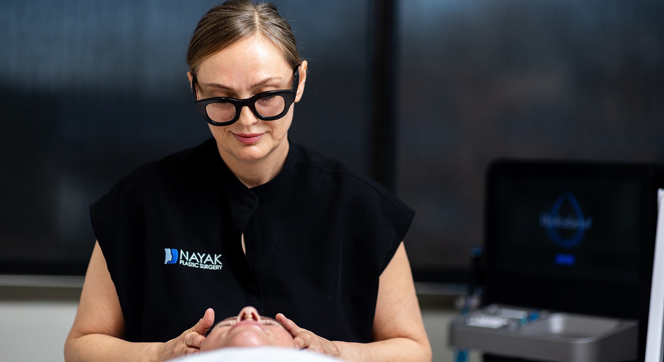 Medical professional at Avani Derm Spa performing a facial treatment.